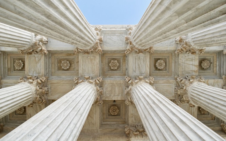 Classical stone columns seen from below